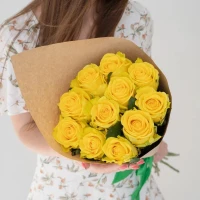 Bouquet of 11 yellow roses with greenery